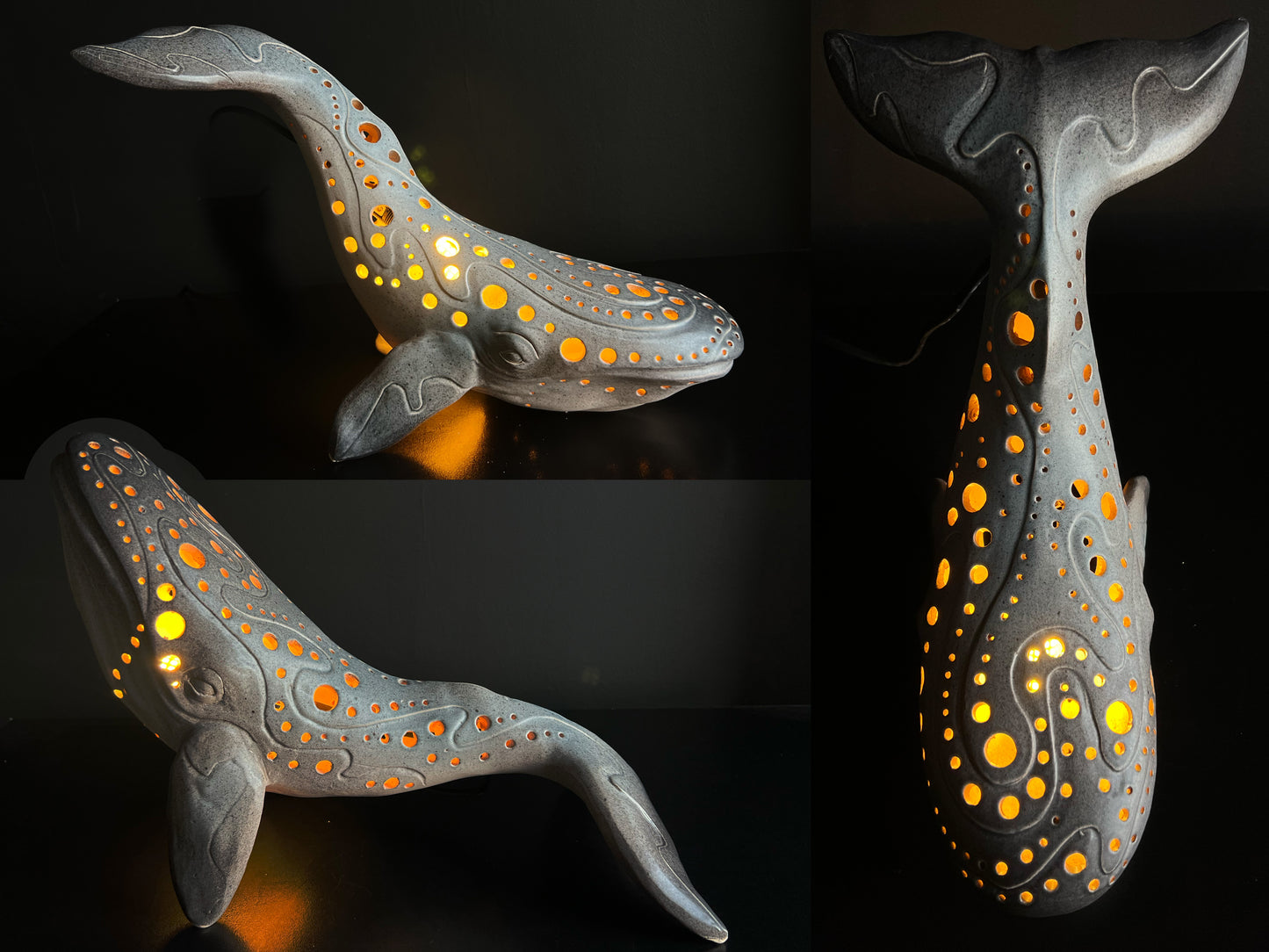 Decorative whale-shaped lamp with glowing interior on a dark background