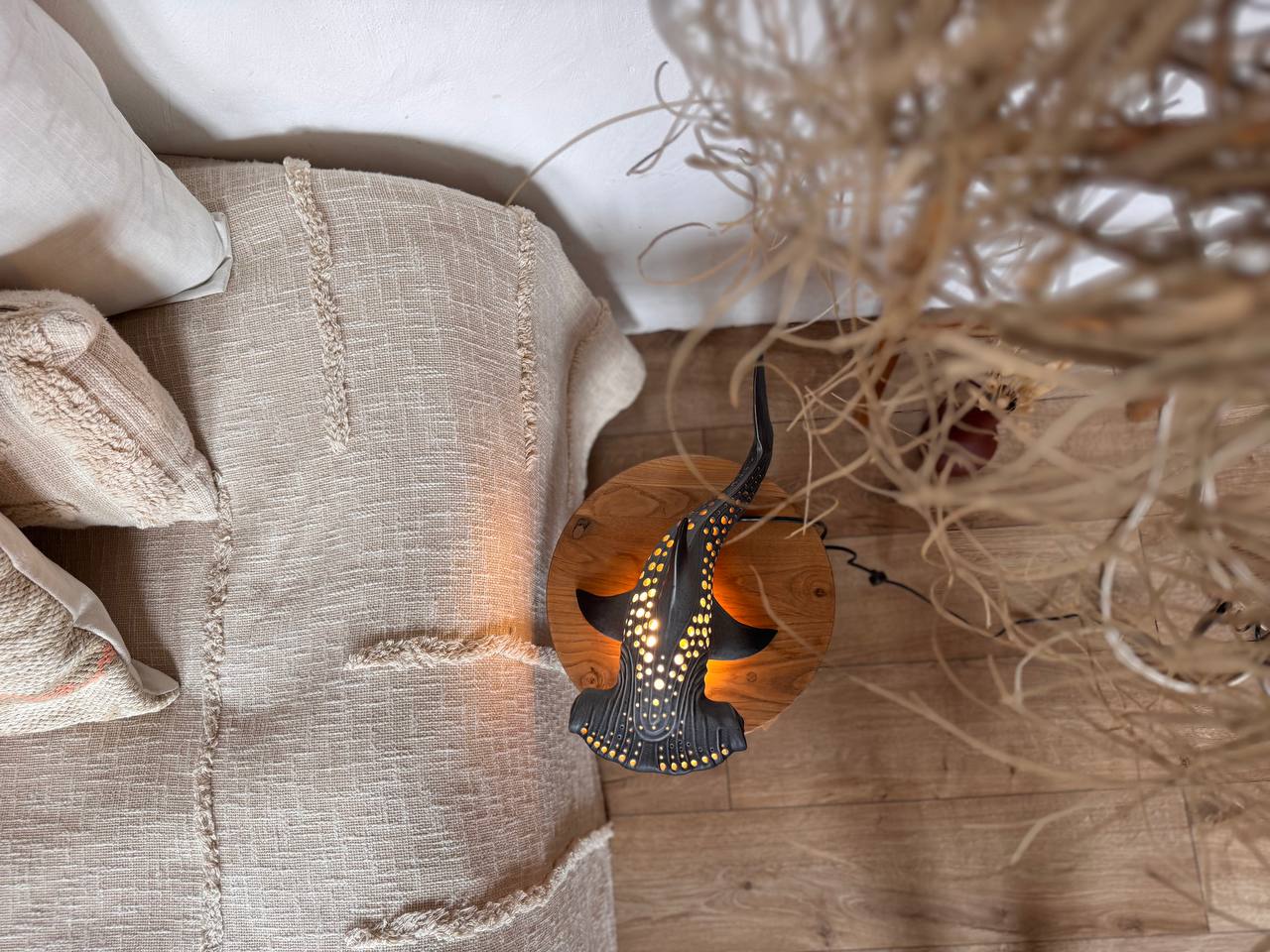 Decorative lamp with geometric design on a textured surface