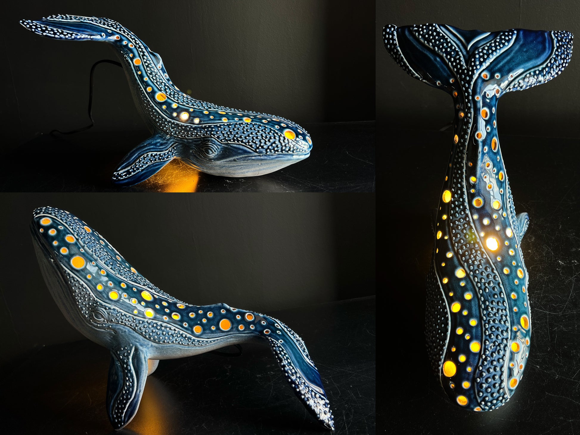 Decorative whale-shaped light with blue and yellow pattern on a dark background