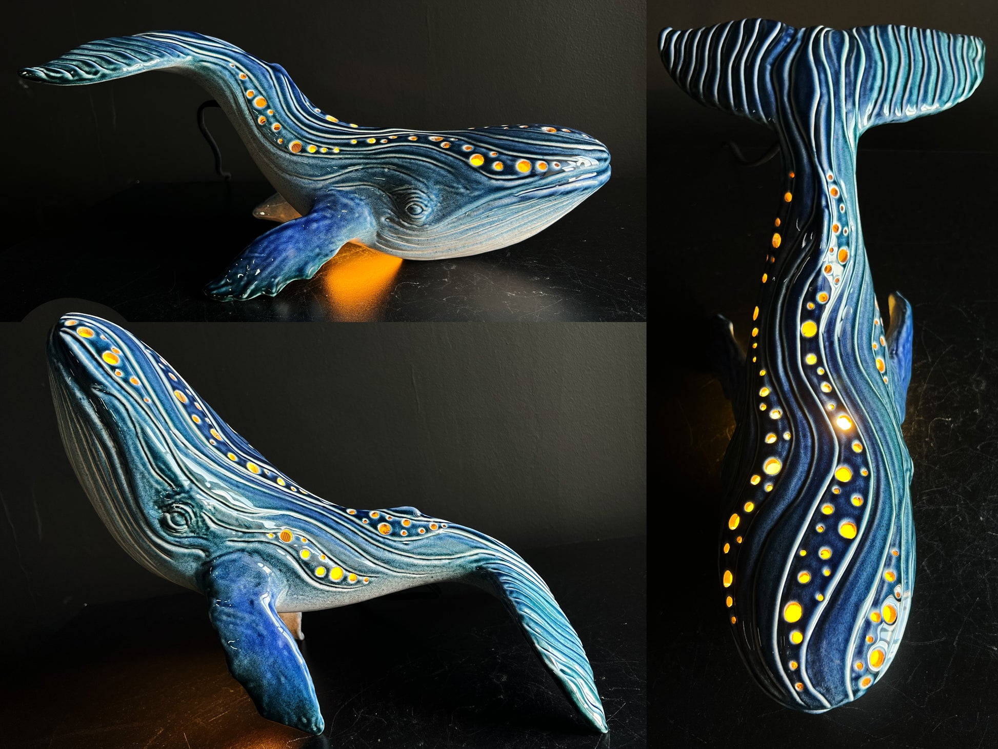Decorative whale-shaped lamp with glowing interior on a dark background