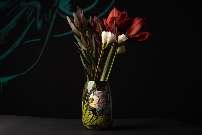 Vase with flowers on a dark background